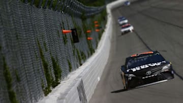 LONG POND, PA - JULY 30: Martin Truex Jr., driver of the #78 Furniture Row/Denver Mattress Toyota, leads a pack of cars during the Monster Energy NASCAR Cup Series Overton's 400 at Pocono Raceway on July 30, 2017 in Long Pond, Pennsylvania. (Photo by Jonathan Ferrey/Getty Images)