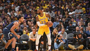 LOS ANGELES, CA - OCTOBER 25: NBA legend, Kobe Bryant looks on as LeBron James #23 of the Los Angeles Lakers dribbles the ball against the Denver Nuggets on October 25, 2018 at STAPLES Center in Los Angeles, California. NOTE TO USER: User expressly acknowledges and agrees that, by downloading and/or using this Photograph, user is consenting to the terms and conditions of the Getty Images License Agreement. Mandatory Copyright Notice: Copyright 2018 NBAE (Photo by Andrew D. Bernstein/NBAE via Getty Images)