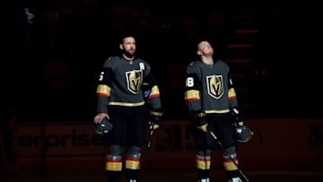 LAS VEGAS, NV - FEBRUARY 22: Deryk Engelland #5 and Nate Schmidt #88 of the Vegas Golden Knights stand at attention during the national anthem prior to a game against the Winnipeg Jets at T-Mobile Arena on February 22, 2019 in Las Vegas, Nevada. (Photo by David Becker/NHLI via Getty Images)