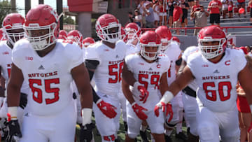 LINCOLN, NE - SEPTEMBER 23: Offensive lineman Tariq Cole #65 of the Rutgers Scarlet Knights and offensive lineman Dorian Miller #60 lead the team on the field before the game against the Nebraska Cornhuskers at Memorial Stadium on September 23, 2017 in Lincoln, Nebraska. (Photo by Steven Branscombe/Getty Images)