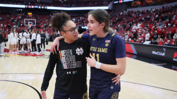 LOUISVILLE, KENTUCKY - FEBRUARY 26: Sonia Citron #11 of the Notre Dame Fighting Irish and Olivia Miles #5 walk off the court following the 68-65 win over the Louisville Cardinals against the at KFC YUM! Center on February 26, 2023 in Louisville, Kentucky. (Photo by Andy Lyons/Getty Images)