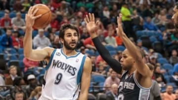 Apr 8, 2014; Minneapolis, MN, USA; Minnesota Timberwolves guard Ricky Rubio (9) passes behind his head at Target Center. Mandatory Credit: Brad Rempel-USA TODAY Sports