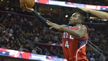 Nov 15, 2014; Cleveland, OH, USA; Atlanta Hawks forward Paul Millsap (4) drives to the basket in the second quarter against the Cleveland Cavaliers at Quicken Loans Arena. Mandatory Credit: David Richard-USA TODAY Sports