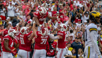 MADISON, WI - SEPTEMBER 21: Wisconsin Badgers running back Jonathan Taylor (23) celebrates with his teammates after scoring his second touchdown of the first quarter durning a college football game between the Michigan Wolverines and the Wisconsin Badgers on September 21, 2019, at Camp Randall Stadium in Madison, WI. (Photo by Dan Sanger/Icon Sportswire via Getty Images)