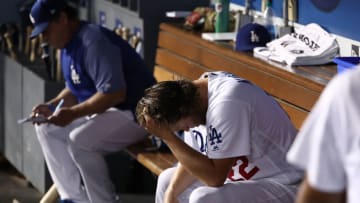 LOS ANGELES, CA - SEPTEMBER 07: Starting pitcher Clayton Kershaw #22 of the Los Angeles Dodgers holds his head in this hand shortly after leaving the game in the fourth inning during the MLB game against the Colorado Rockies at Dodger Stadium on September 7, 2017 in Los Angeles, California. (Photo by Victor Decolongon/Getty Images)