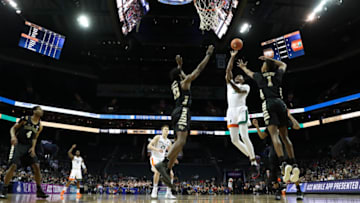 CHARLOTTE, NORTH CAROLINA - MARCH 12: Anthony Lawrence II #3 of the Miami (Fl) Hurricanes drives to the basket against teammates Jaylen Hoard #10 and Isaiah Mucius #1 of the Wake Forest Demon Deacons during their game in the first round of the 2019 Men's ACC Basketball Tournament at Spectrum Center on March 12, 2019 in Charlotte, North Carolina. (Photo by Streeter Lecka/Getty Images)