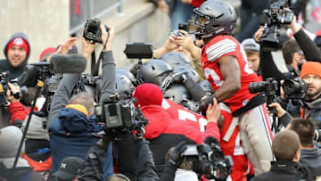 Nov 26, 2016; Columbus, OH, USA; Ohio State Buckeyes wide receiver Terry McLaurin (83) jumps onto the pile after the overtime score to seal the win against the Michigan Wolverines at Ohio Stadium. Ohio State won 30-27. Mandatory Credit: Joe Maiorana-USA TODAY Sports