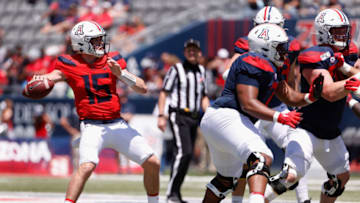TUCSON, ARIZONA - APRIL 24: Quarterback Will Plummer #15 of the Arizona Wildcats (Team Blue) drops back to pass during the Arizona Spring game at Arizona Stadium on April 24, 2021 in Tucson, Arizona. (Photo by Christian Petersen/Getty Images)