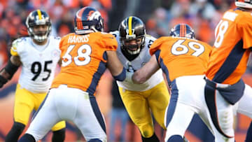 Jan 17, 2016; Denver, CO, USA; Pittsburgh Steelers defensive end Cameron Heyward (97) is double teamed by Denver Broncos tackle Ryan Harris (68) and guard Evan Mathis (69) during the third quarter of the AFC Divisional round playoff game at Sports Authority Field at Mile High. Mandatory Credit: Matthew Emmons-USA TODAY Sports