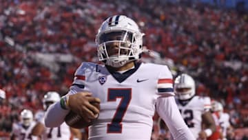 Nov 5, 2022; Salt Lake City, Utah, USA; Arizona Wildcats quarterback Jayden de Laura (7) celebrates scoring a touchdown against the Utah Utes in the first quarter at Rice-Eccles Stadium. Mandatory Credit: Rob Gray-USA TODAY Sports