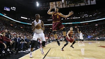 Dec 5, 2015; Miami, FL, USA; Miami Heat forward Chris Bosh (1) avoids Cleveland Cavaliers forward Kevin Love (0) during the second half at American Airlines Arena. The Heat won 99-84. Mandatory Credit: Steve Mitchell-USA TODAY Sports