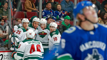 VANCOUVER, BC - OCTOBER 29: Jordan Greenway #18 of the Minnesota Wild is congratulated by teammate after scoring during their NHL game against the Vancouver Canucks at Rogers Arena October 29, 2018 in Vancouver, British Columbia, Canada. (Photo by Jeff Vinnick/NHLI via Getty Images)