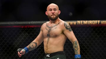 May 13, 2020; Jacksonville, Florida, USA; Brian Kelleher (blue gloves) defeats Hunter Azure (red gloves) during UFC Fight Night at VyStar Veterans Memorial Arena. Mandatory Credit: Jasen Vinlove-USA TODAY Sports