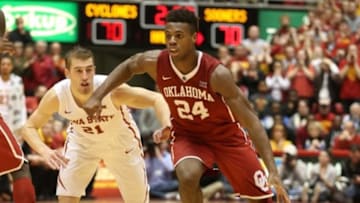 Jan 18, 2016; Ames, IA, USA; Oklahoma Sooners guard Buddy Hield (24) dribbles against Iowa State Cyclones guard Matt Thomas (21) at James H. Hilton Coliseum. The Cyclones beat the Sooners 82-77. Mandatory Credit: Reese Strickland-USA TODAY Sports