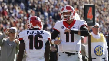 Nov 14, 2015; Auburn, AL, USA; Georgia Bulldogs receiver Isaiah McKenzie (16) celebrates with quarterback Greyson Lambert (11) after returning a punt for a touchdown during the fourth quarter at Jordan Hare Stadium. The Bulldogs beat the Tigers 20-13. Mandatory Credit: John Reed-USA TODAY Sports