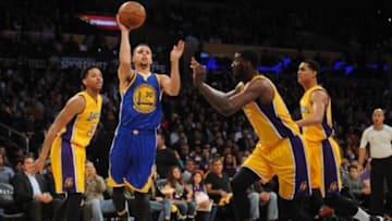 January 5, 2016; Los Angeles, CA, USA; Golden State Warriors guard Stephen Curry (30) moves to the basket against Los Angeles Lakers center Roy Hibbert (17) during the first half at Staples Center. Mandatory Credit: Gary A. Vasquez-USA TODAY Sports