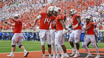 STILLWATER, OK - SEPTEMBER 15: Quarterback Taylor Cornelius #14 and running back Justice Hill #5 of the Oklahoma State Cowboys celebrate a touchdown against the Boise State Broncos at Boone Pickens Stadium on September 15, 2018 in Stillwater, Oklahoma. The Cowboys defeated the Broncos 44-21. (Photo by Brett Deering/Getty Images)