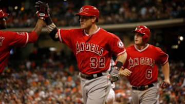 Apr 5, 2014; Houston, TX, USA; Los Angeles Angels left fielder Josh Hamilton (32) high-fives second baseman Howie Kendrick (47) after hitting a three-run home run during the fifth inning against the Houston Astros at Minute Maid Park. Mandatory Credit: Andrew Richardson-USA TODAY Sports
