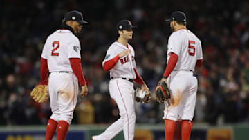 BOSTON, MA - OCTOBER 24: Xander Bogaerts #2, Andrew Benintendi #16 and Ian Kinsler #5 of the Boston Red Sox celebrate their teams 4-2 win over the Los Angeles Dodgers in Game Two of the 2018 World Series at Fenway Park on October 24, 2018 in Boston, Massachusetts. (Photo by Elsa/Getty Images)