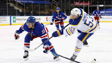Apr 27, 2021; New York, NY, USA; Adam Fox #23 of the New York Rangers defends as Jeff Skinner #53 of the Buffalo Sabres takes the first period shot at Madison Square Garden on April 27, 2021 in New York City. Mandatory Credit: Bruce Bennett/Pool Photo-USA TODAY Sports