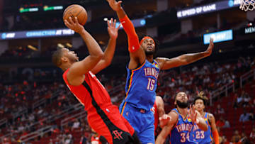 Eric Gordon #10 of the Houston Rockets shoots the ball while defended by Derrick Favors #15 of the Oklahoma City Thunder in the first half at Toyota Center on October 22, 2021 in Houston, Texas. NOTE TO USER: User expressly acknowledges and agrees that, by downloading and or using this photograph, User is consenting to the terms and conditions of the Getty Images License Agreement. (Photo by Tim Warner/Getty Images)