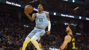 May 7, 2022; San Francisco, California, USA; Memphis Grizzlies guard Ja Morant (12) drives to the basket against Golden State Warriors guard Klay Thompson (11) during the third quarter of game three of the second round for the 2022 NBA playoffs at Chase Center. Mandatory Credit: D. Ross Cameron-USA TODAY Sports