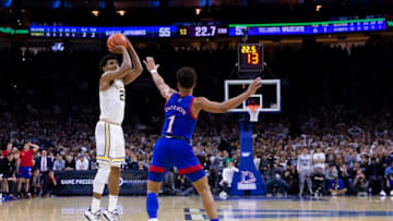 PHILADELPHIA, PA - DECEMBER 21: Jermaine Samuels #23 of the Villanova Wildcats shoots the ball a three point shot against Devon Dotson #1 of the Kansas Jayhawks in the second half at the Wells Fargo Center on December 21, 2019 in Philadelphia, Pennsylvania. The Villanova Wildcats defeated the Kansas Jayhawks 56-55. (Photo by Mitchell Leff/Getty Images)