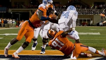 Sep 10, 2016; Champaign, IL, USA; Illinois Fighting Illini defensive lineman Dawuane Smoot (91) and defensive lineman Carroll Phillips (6) tackle North Carolina Tar Heels running back Elijah Hood (34) in the endzone for a safety during the 2nd quarter at Memorial Stadium. Mandatory Credit: Mike Granse-USA TODAY Sports