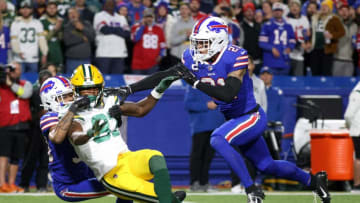 Bills Jordan Poyer and Dane Jackson break up a pass intended for Packers receiver Romeo Doubs.
