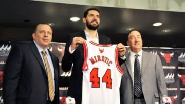 Jul 18, 2014; Chicago, IL, USA; Chicago Bulls head coach Tom Thibodeau (left), new player Nikola Mirotic (middle) and general manager Gar Forman pose for a photo after a press conference at the United Center. Mandatory Credit: David Banks-USA TODAY Sports