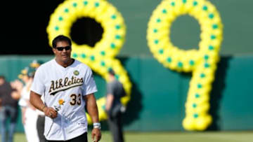 Jul 19, 2014; Oakland, CA, USA; Oakland Athletics former player Jose Canseco (33) takes the field during the celebration of the 1989 Oakland Athletics World Series Champions before the game against Baltimore Orioles at O.co Coliseum. Mandatory Credit: Bob Stanton-USA TODAY Sports
