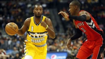 Jan 31, 2014; Denver, CO, USA; Denver Nuggets forward Jordan Hamilton (1) drives to the basket during the first half against the Toronto Raptors at Pepsi Center. Mandatory Credit: Chris Humphreys-USA TODAY Sports