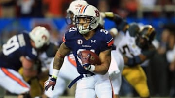 Dec 7, 2013; Atlanta, GA, USA; DUPLICATE***Auburn Tigers running back Tre Mason (21) carries the ball against the Missouri Tigers in the second quarter during the 2013 SEC Championship game at Georgia Dome.. Mandatory Credit: Daniel Shirey-USA TODAY Sports