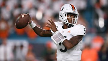 MIAMI, FLORIDA - OCTOBER 11: N'Kosi Perry #5 of the Miami Hurricanes looks to pass against the Virginia Cavaliers in the first half at Hard Rock Stadium on October 11, 2019 in Miami, Florida. (Photo by Mark Brown/Getty Images)