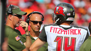 TAMPA, FLORIDA - NOVEMBER 11: Head coach Dirk Koetter of the Tampa Bay Buccaneers and Ryan Fitzpatrick #14 wait for the ruling on a backwards pass call in the first quarter against the Washington Redskins at Raymond James Stadium on November 11, 2018 in Tampa, Florida. (Photo by Will Vragovic/Getty Images)