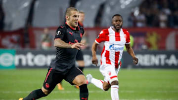 BELGRADE, SERBIA - OCTOBER 19: JJack Wilshere (L) of Arsenal in action against Guelor Kanga (R) of Crvena Zvezda during the UEFA Europa League group H match between Crvena Zvezda and Arsenal FC at Rajko Mitic Stadium on October 19, 2017 in Belgrade, Serbia. (Photo by Srdjan Stevanovic/Getty Images)