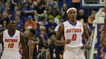 Nov 16, 2015; Gainesville, FL, USA; Florida Gators guard Kasey Hill (0) and forward Dorian Finney-Smith (10) react after they made as basket against the North Carolina A&T Aggies during the first half at Stephen C. O'Connell Center. Mandatory Credit: Kim Klement-USA TODAY Sports