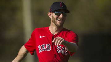 Feb 22, 2021; Fort Myers, FL, USA; Boston Red Sox pitcher Chris Sale warms up during the first day Spring Training for the full squad at Jet Blue Park in Fort Myers on Monday, February 22, 2021. He is recovering from Tommy John surgery and is it is uncertain when he is returning. Mandatory Credit: Andrew West/The News-Press-USA TODAY Sports