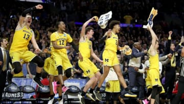 The Michigan Wolverines bench celebrates in the games final minutes against the Texas A&M Aggies in the 2018 NCAA Men's Basketball Tournament West Regional at Staples Center on March 22, 2018 in Los Angeles, California. (Photo by Ezra Shaw/Getty Images)