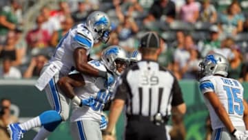 Sep 28, 2014; East Rutherford, NJ, USA; Detroit Lions tight end Eric Ebron (85) celebrates with teammates after scoring a touchdown against the New York Jets during the second quarter at MetLife Stadium. Mandatory Credit: Adam Hunger-USA TODAY Sports