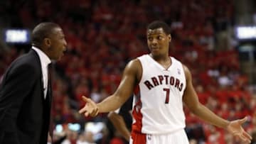 May 4, 2014; Toronto, Ontario, CAN; Toronto Raptors head coach Dwane Casey and Toronto Raptors guard Kyle Lowry (7) reacts after a call in game seven of the first round of the 2014 NBA Playoffs against the Brooklyn Nets at the Air Canada Centre. Brooklyn defeated Toronto 104-103. Mandatory Credit: John E. Sokolowski-USA TODAY Sports