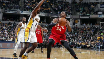 Mar 17, 2016; Indianapolis, IN, USA; Toronto Raptors forward Patrick Patterson (54) is guarded by Indiana Pacers forward Solomon Hill (44) at Bankers Life Fieldhouse. Toronto defeats Indiana 101-94 in overtime. Mandatory Credit: Brian Spurlock-USA TODAY Sports