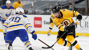 Mar 27, 2021; Boston, Massachusetts, USA; Boston Bruins right wing Craig Smith (12) tries to get past Buffalo Sabres defenseman Jacob Bryson (78) during the third period at TD Garden. Mandatory Credit: Winslow Townson-USA TODAY Sports
