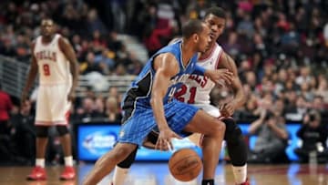 Dec 16, 2013; Chicago, IL, USA; Orlando Magic shooting guard Arron Afflalo (4) is defended by Chicago Bulls shooting guard Jimmy Butler (21) during the first half at the United Center. Mandatory Credit: Rob Grabowski-USA TODAY Sports
