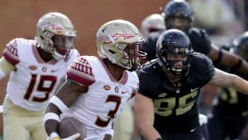 WINSTON SALEM, NC - SEPTEMBER 30: Cam Akers #3 of the Florida State Seminoles runs with the ball against the defense of the Wake Forest Demon Deacons during their game at BB&T Field on September 30, 2017 in Winston Salem, North Carolina. (Photo by Streeter Lecka/Getty Images)