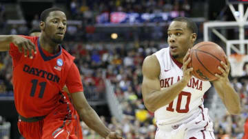 Mar 22, 2015; Columbus, OH, USA; Oklahoma Sooners guard Jordan Woodard (10) works the ball against Dayton Flyers guard Scoochie Smith (11) during the first half in the third round of the 2015 NCAA Tournament at Nationwide Arena. Mandatory Credit: Joe Maiorana-USA TODAY Sports