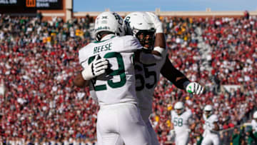 Auburn footballNov 5, 2022; Norman, Oklahoma, USA; Baylor Bears running back Richard Reese (29) celebrates after scoring a touchdown with offensive lineman Micah Mazzccua (65) against the Oklahoma Sooners during the second half at Gaylord Family-Oklahoma Memorial Stadium. Mandatory Credit: Chris Jones-USA TODAY Sports