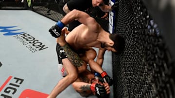 AUCKLAND, NEW ZEALAND - FEBRUARY 23: (L-R) Zubaira Tukhugov of Russia punches Kevin Aguilar in their featherweight bout during the UFC Fight Night event at Spark Arena on February 23, 2020 in Auckland, New Zealand. (Photo by Jeff Bottari/Zuffa LLC)