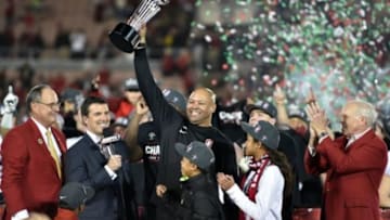 Jan 1, 2016; Pasadena, CA, USA; Stanford Cardinal head coach David Shaw celebrates with the Rose Bowl Game Trophy after defeating the Iowa Hawkeyes in the 2016 Rose Bowl at Rose Bowl. Mandatory Credit: Kirby Lee-USA TODAY Sports