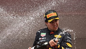 Red Bull Racing's Mexican driver Sergio Perez celebrates with champagne after winning the Monaco Formula 1 Grand Prix at the Monaco street circuit in Monaco, on May 29, 2022. (Photo by SEBASTIEN BOZON / AFP) (Photo by SEBASTIEN BOZON/AFP via Getty Images)